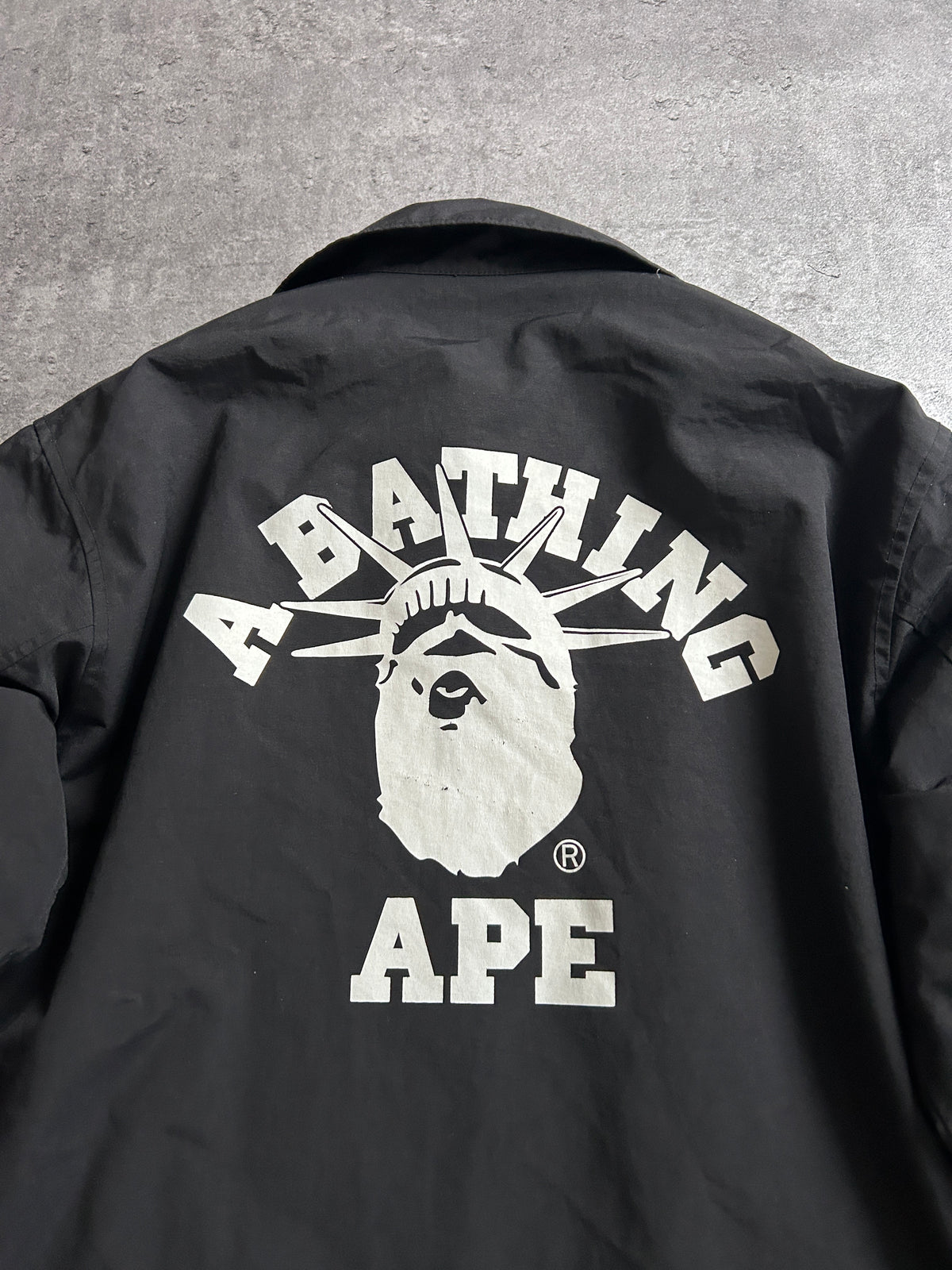 A BATHING APE STATUE OF LIBERTY COACH JACKET (M)