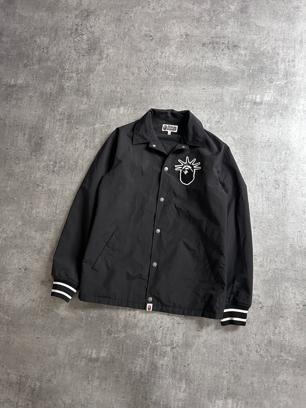 A BATHING APE STATUE OF LIBERTY COACH JACKET (M)